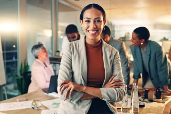 Smiling professionals collaborating in a modern office